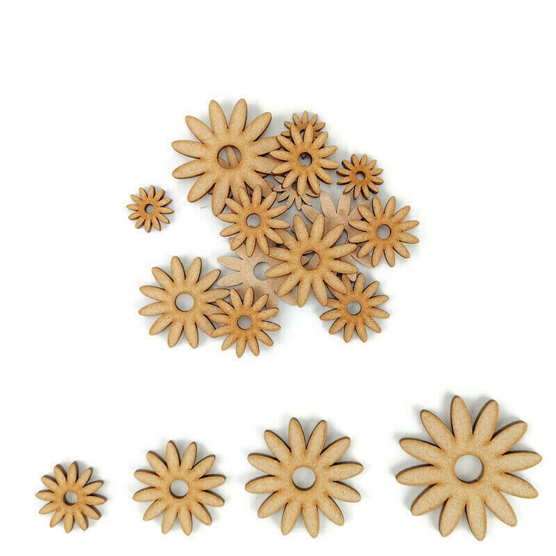 May include: A collection of wooden flower shapes in various sizes, all in a natural wood color. The flowers are arranged in a cluster, with the largest flower at the top and the smallest flowers at the bottom.