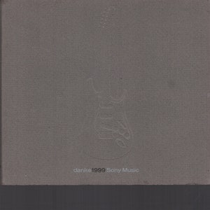 May include: A gray CD case with a stylized guitar design and the text "danke 1999 Sony Music."