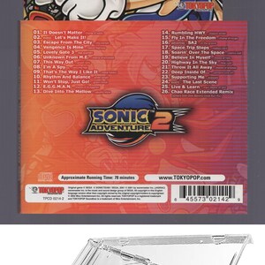 May include: A CD case for the Sonic Adventure 2 Official Soundtrack. The cover shows Sonic, Tails, Knuckles, and Shadow. The rear lists song titles. The case is made of clear plastic.