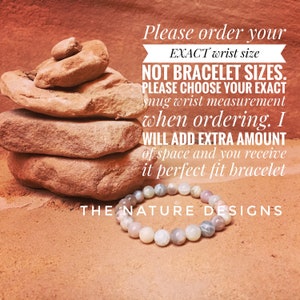 May include: A bracelet made of natural stones in shades of gray, white, and brown. The bracelet is lying on a red, sandy surface. The text "Please order your EXACT wrist size NOT BRACELET SIZES. PLEASE CHOOSE YOUR EXACT snug wrist measurement when ordering. I WILL ADD EXTRA AMOUNT of space and you receive it perfect fit bracelet THE NATURE DESIGNS" is written in white text on a white background.
