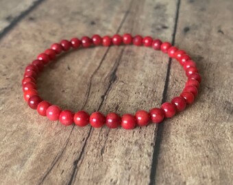 FAMA Red Coral Beaded Stretch Bracelet with Golden Paved Beads FAMA Red Coral Beaded Stretch Bracelet with Golden Paved Beads