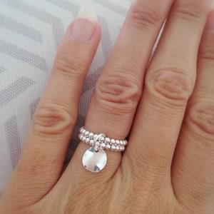Double row ring and wavy medal in 925 silver