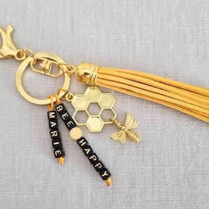 Chaveiro de abelha personalizável “Bee Happy” – com nome desejado e conta de sorriso – leve e elegante