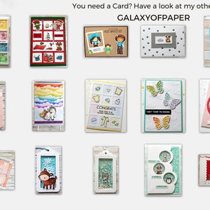 May include: A collection of handmade greeting cards featuring various themes, including a unicorn, butterflies, a snowman, and a Christmas scene. The cards are decorated with glitter, paper cutouts, and other embellishments. The text "GALAXYOFPAPER" is visible at the top of the image.