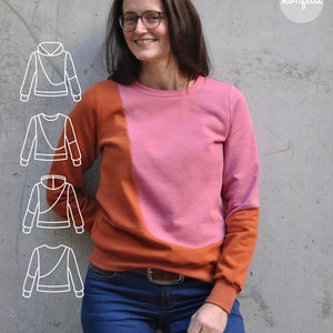 May include: A woman wearing a pink and orange sweatshirt with a diagonal seam. The sweatshirt has a crew neck and long sleeves. The woman is wearing blue jeans and has brown hair. The image also includes four line drawings of different sweatshirt styles.