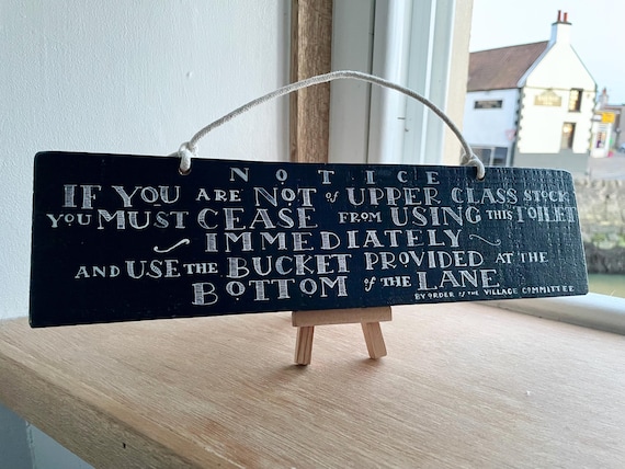 Hand-painted Victorian-style toilet sign with actual humor baked in — the kind of bathroom art that makes guests do a double-take.