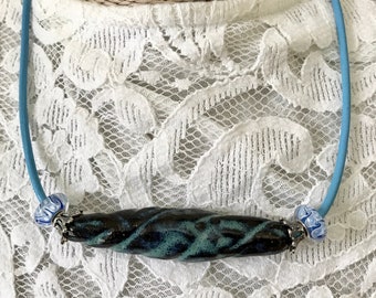 Blue Glazed Dark Stoneware Twisted Tube Necklace on Blue Leather Cord and Hand Forged Bead Caps