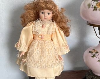 Vintage Porcelain Bisque Doll with Stand Blue Eyes Red Hair Peach Dress Collect or Gift Ginger Doll
