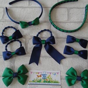 May include: A collection of children's hair accessories, including headbands and bows. The items feature a color scheme of navy blue and green. The business card in the image reads "Sandi's Mini Styles".