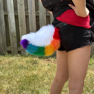 White and rainbow fursuit pride nub tail