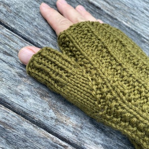 May include: Olive green fingerless knitted gloves with a ribbed texture.