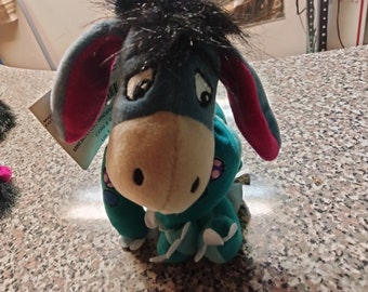 The Disney Store's Eeyore, The Cute Blue Donkey In a Dinosaur Outfit And Bow on His Tail, Fine Mane And Hair