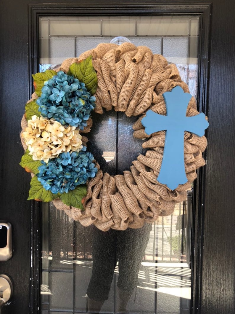 Burlap Wreath with beige burlap and blue and off white Hydrangeas with cross