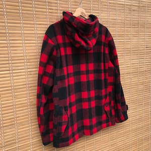 May include: Red and black plaid hooded jacket with a zipper closure and two pockets.
