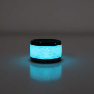 Carbon Fiber Ring With aqua Glow, polished finish.