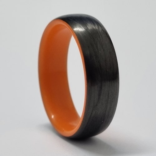Unidirectional carbon Fiber, Glow in shops the dark,men's wedding ring,Orange glow ring,bridal ring,black band ring,ring men's,polished finish.