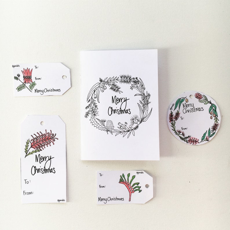 May include: Four gift tags with a Christmas theme featuring Australian native flora. The tags are white with black outlines and red and green watercolour illustrations. The text on the tags reads "Merry Christmas".