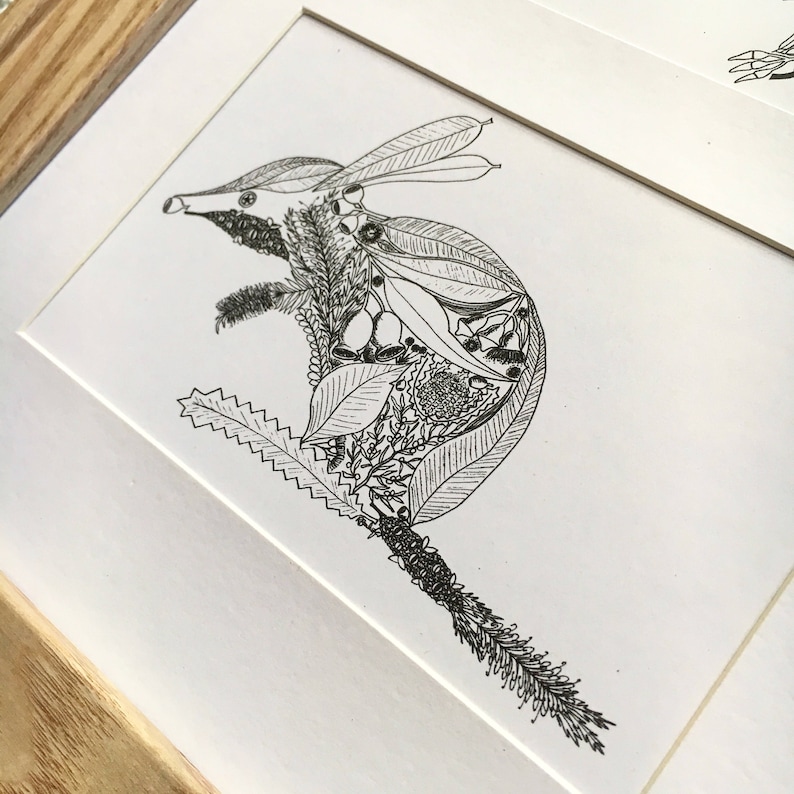 May include: A black and white line drawing of a bandicoot made entirely of leaves, flowers, and other botanical elements.