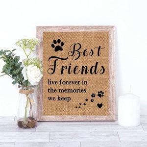 May include: A framed burlap sign with the text "Best Friends live forever in the memories we keep". The sign features a paw print and a heart.