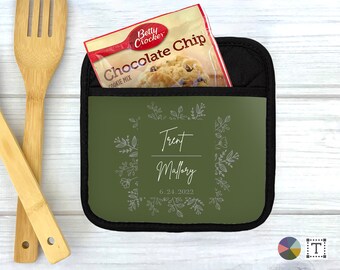 May include: Green pot holder with a floral design and the text "Trent Mallory 6.24.2022".