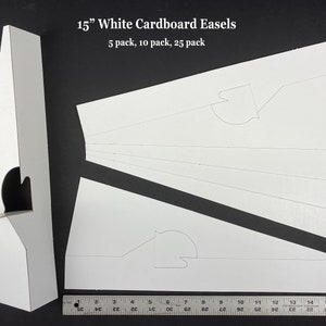 May include: White cardboard easels, 15 inches tall, in a 5 pack, 10 pack, and 25 pack. The easels are folded flat and ready to assemble.