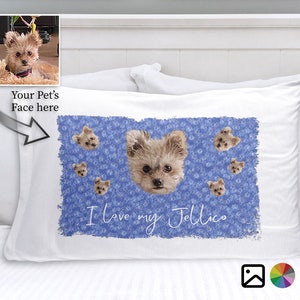 May include: White pillowcase with a blue background featuring a repeated pattern of small blue flowers and a dog's face. The dog's face is repeated throughout the pattern. The text "I love my Jellico" is printed in white on the pillowcase.