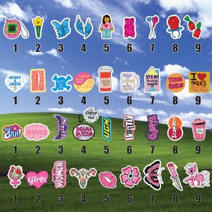 a collection of stickers with various designs and text, arranged in a grid format. The stickers are displayed against a backdrop of a grassy field under a blue sky with clouds.