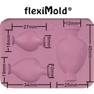 May include: A pink silicone mold with two vase shapes. The mold measures 4.5 inches by 2.7 inches. The larger vase is 1.8 inches tall and 1 inch wide. The smaller vase is 1.3 inches tall and 1.3 inches wide.