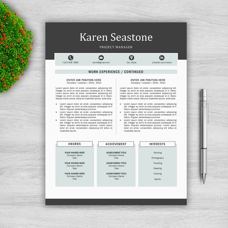 May include: A black and white CV template with a grey background. The CV is for Karen Seastone, Project Manager. The CV includes contact information, work experience, awards, achievements, and interests.