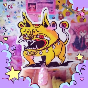 May include: A yellow and red cartoon dog sticker with a fierce expression, wearing a spiked collar. The sticker is on a white background and has a glossy finish.