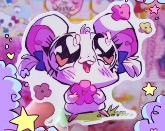 Pode incluir: Um adesivo de um animal de desenho animado com olhos grandes, bochechas cor-de-rosa e uma flor na mão. O animal está usando um chapéu roxo e um laço azul. O adesivo está em um fundo rosa e roxo.