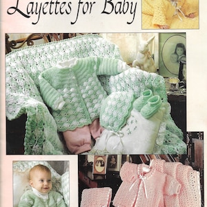 May include: Crocheted layette patterns for baby. Four designs by Carole Prior. The image shows a green crocheted baby outfit, a pink crocheted baby outfit, and a yellow crocheted baby outfit.