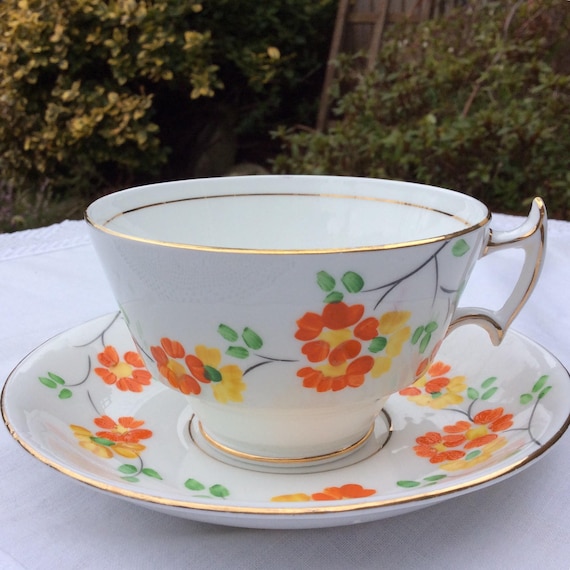 Art Deco English Bone China: Phoenix Tea Cup and Saucer, 1920