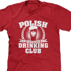 May include: Red t-shirt with white text that reads "Polish Drinking Club" and a graphic of a beer glass with the Polish flag.