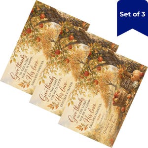 May include: A set of three rectangular prints featuring an autumn orchard scene with red apples on trees and a basket of apples. The text reads: Give thanks to the Lord, for He is good; His love endures forever. Psalm 107:1. Grateful hearts gather here.