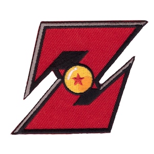 May include: A red embroidered patch in the shape of a stylized letter Z with a black border and a central circular yellow sphere featuring a single red star and a white highlight, representing a classic anime-inspired design element.