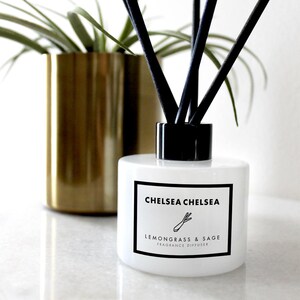 May include: White diffuser bottle with a black lid and black reeds. The label reads "Chelsea Chelsea Lemongrass & Sage Fragrance Diffuser".