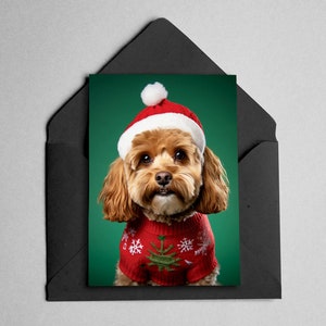 May include: A brown and white dog wearing a red and white Christmas jumper and a red Santa hat with a white pom-pom on a green background.