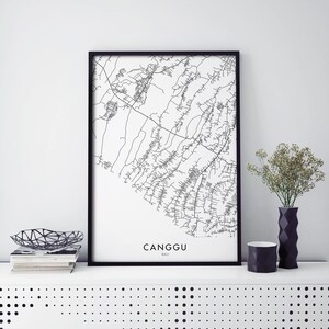 May include: Black and white line art map print of Canggu, Bali in a black frame. The map shows the streets and roads of the area.