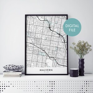 May include: A black and white map print of Malvern, VIC 3144, Australia. The map is framed in a black frame and has a white background. The text "DIGITAL FILE" is in a light blue box in the upper right corner of the image.