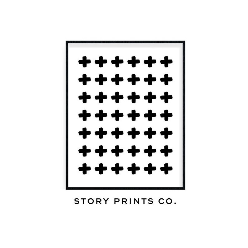 May include: Black and white printable art print with a repeating pattern of plus signs. The print has a black frame and the text "STORY PRINTS CO." at the bottom.