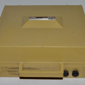 May include: A beige vintage Videla 8-track player with the text "Videla 8-Track Stereo System" and "RCA" on the top.