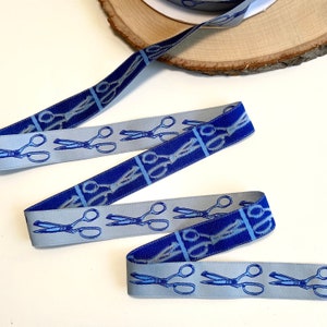 Back in Stock!   Sewing Scissors Jacquard Ribbon yardage. New on roll. Tula Pink for Renaissance ribbons. Blue Shears on light blue trim
