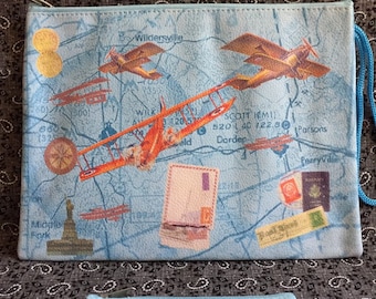 Airplane Sectional Purse Set in Blue. Secure zippered opening. 9 x 7" zippy pouch and 5 x3" matching coin purse. Lined. aviation Map collage