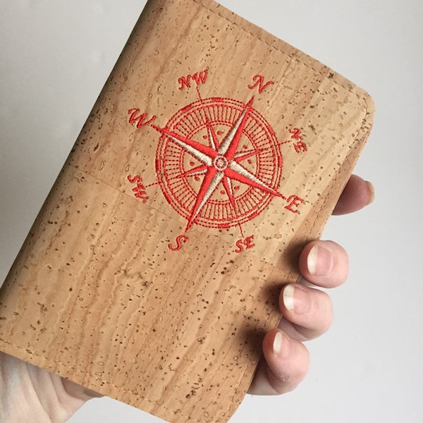 Natural Cork Passport Travel Wallet. Wrap your passport in this durable cork case. Embroidered Compass Rose with credit card pockets