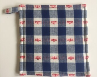 Red Biplane airplanes on blue gingham Hot pad. Insulbrite and batting inside for heat resistance. 8 inches square. Aviation home gift