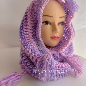 May include: A purple and pink crocheted hooded scarf with long tassels. The scarf is made with a soft, textured yarn.