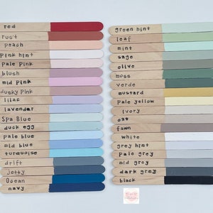The Woodvine colour chart, with lots of lolly stick painted in various colours with colour names on.