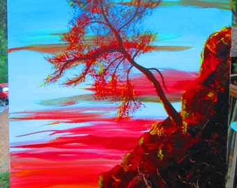 May include: Abstract painting of a red tree with a dark blue sky and red and orange clouds. The tree is on a cliff with a dark brown and red rock face.