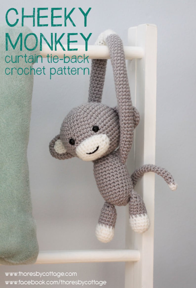 May include: A gray crocheted monkey toy with white accents hanging from a white wooden ladder. The monkey is holding onto the ladder with its arms and has a long tail. The text "CHEEKY MONKEY curtain tie-back crochet pattern" is visible at the top of the image.